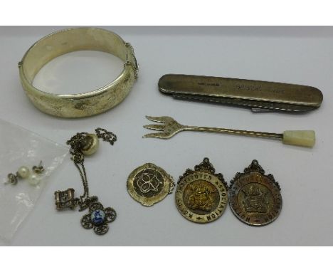 A silver bangle, two silver Nott'm Institutes Association table tennis fobs, a penknife, a/f, etc.