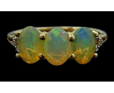 9ct gold three stone opal ring, with pierced diamond set shoulders, hallmarked Condition Report:Approx 2.3gm, size P-Q, well 