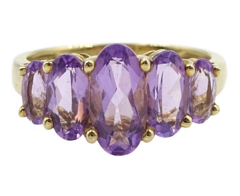 9ct gold five stone graduating oval amethyst ring, hallmarkedCondition Report:Approx 3gm, size Q-R, good condition 