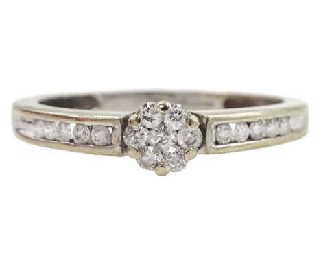 9ct gold diamond cluster ring, with channel set diamond shoulders, hallmarked, total diamond weight 0.25 caratCondition Repor