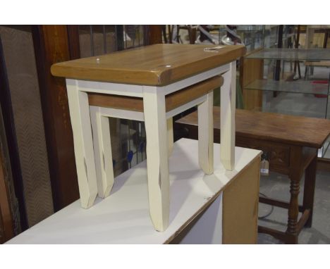 A pair of contemporary oak and painted tea tablesEach table with a light oak slab top raised upon painted legs of square sect