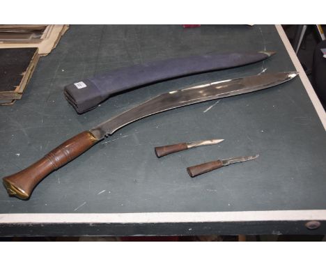 Large Kukari 20th Century56cm single edged blade, wooden grips, complete with material covered scabbard with two karda knives