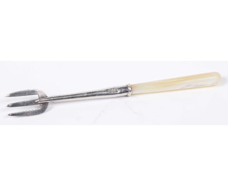 A Charles Horner silver pickle forkWith three prongs and a Mother of Pearl handle, 10cm long. 