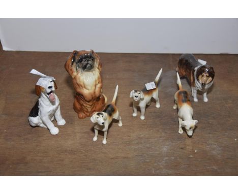 A mixed group of ceramic figuresTo include three Beswick hounds (height 7cm), a Beswick Pomeranian 106 together with Royal Do