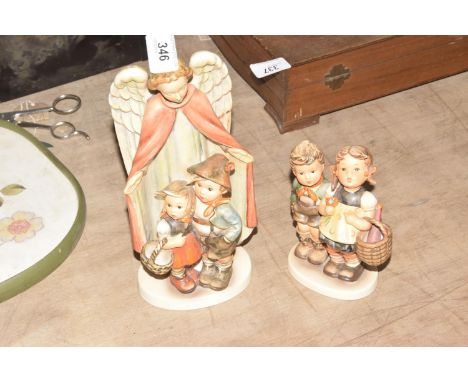Two Hummel Goebel figuresThe large size figures depicting angel and two children numbered 88; 20 cm high and figure with two 