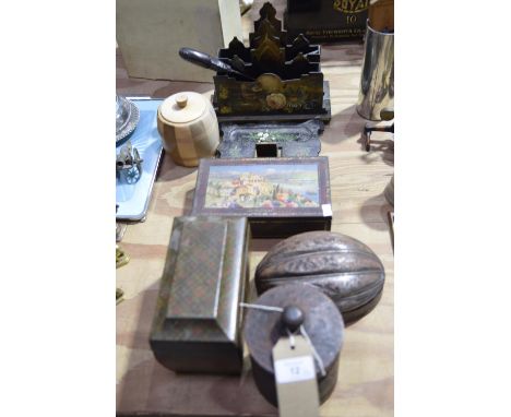 A pair of early 20th Century lacquered papiermache letter racksEach painted with an exotic bird within a garden landscape and