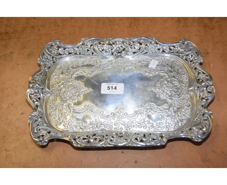 A silver trayOf rectangular outline, with embossed floral decoration and scrolling rim, Henry Matthews, Birmingham, 1903, wei