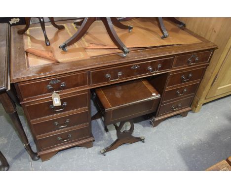 A reproduction mahogany twin pedestal writing deskHaving a leather inset writing surface (af) above three frieze drawers rais