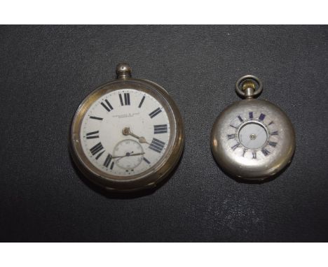 Two silver pocket watchesTo include a half hunter and an open face pocket watch. 