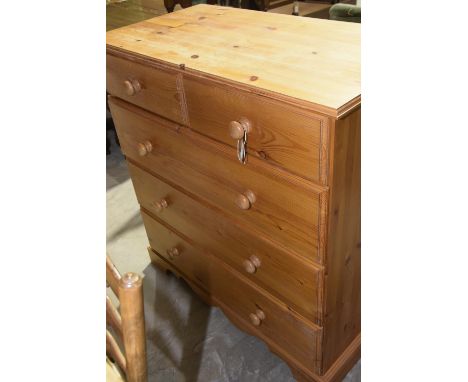 A modern pine chest of drawersThe rectangular top above two short and three long drawers raised upon a shaped apron and plint