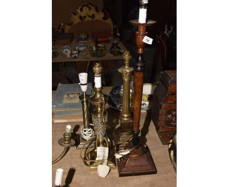 A Corinthian column brass table lampRaised upon a beaded stepped plinth base along with three other assorted table lamps, to 