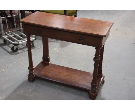 A Victorian mahogany side tableHaving a rectangular top canted front corners above a single frieze drawer raised upon  ring t