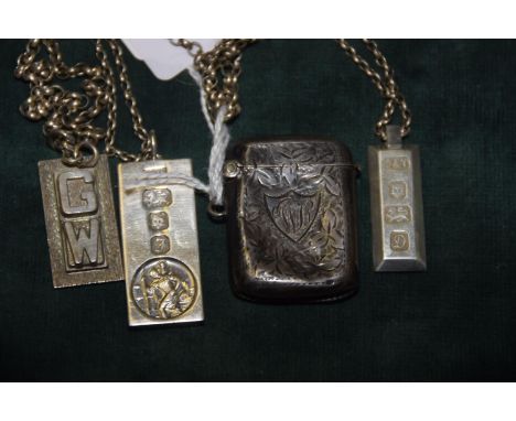 A collection of silver To include three ingots, with two link chains, together with a concave silver vesta case. (6) 