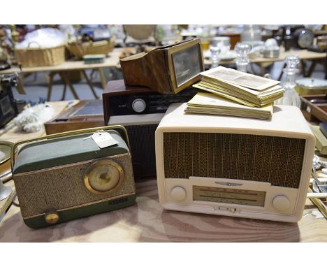 A group of three vintage radio's The first Bush radio VHF 81 (24cm high), the second a Baird radio (17cm high) and a Radio re