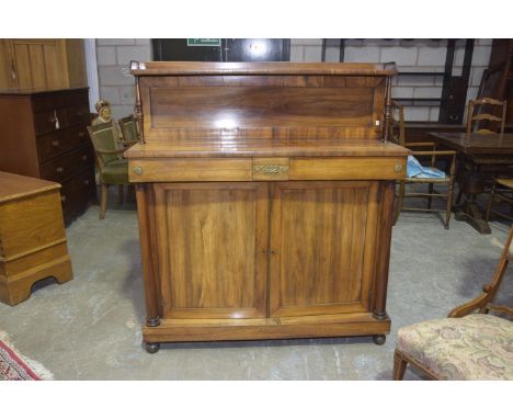 A Mid 19th Century rosewood chiffonierThe raised panel back with a single shelf supported on turned uprights above a rectangu