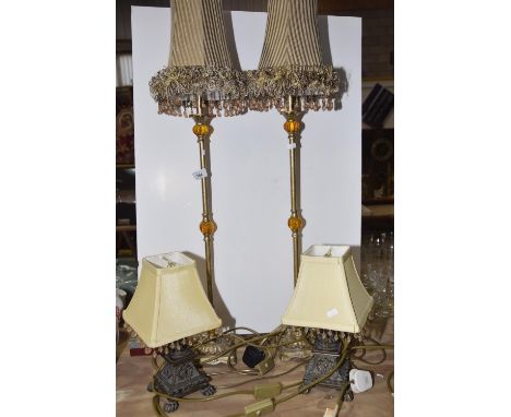 A pair of tall stemmed table lampsThe lamp of square base rising to central shaft with three lobed amber style features.  Tog