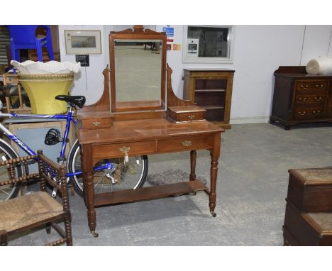 A Victorian walnut dressing tableHaving a rectangular mirrored beveled plated above two small drawers and a rectangular mould