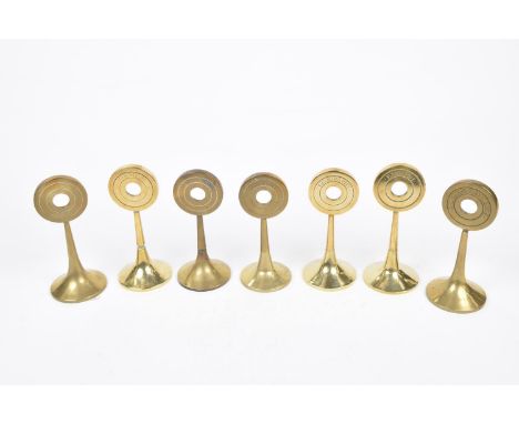 A group of early 20th Century cast brass subject markers, c.1900Each rising from a circular spreading splayed base to a conce