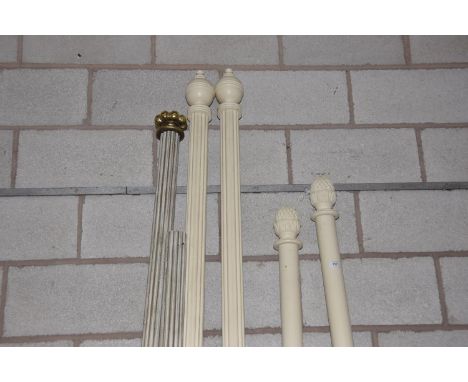 Six assorted painted hardwood curtain poles To include a pair of cylindrical examples with fruit finials complete with curtai