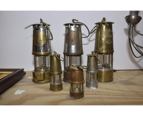 A group of six various miners lampsTo include examples from Protector Lamp Company Ltd, Eccles; Tallest 23cm and smallest 9cm