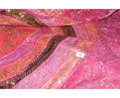 A vibrant Indian wall hanging / throwThe sequined throw decorated in pinks, orange, gold, green and silver with octagonal cen
