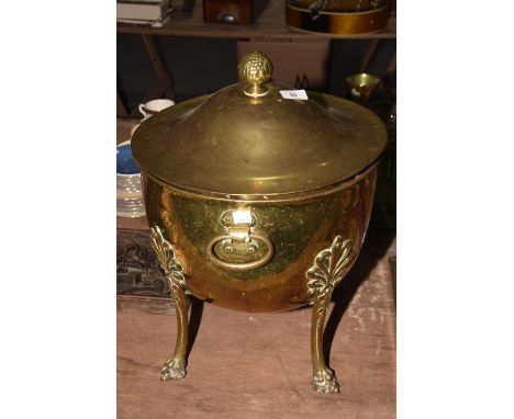A late 19th early 20th Century brass coal bucketThe dome shaped bucket with a circular cover and fruit finial applied with si