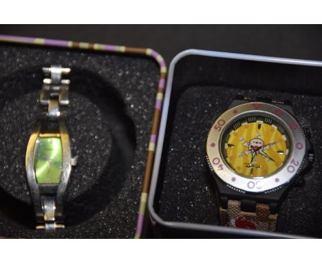 Two watchesTo include a Fossil watch and one other, in tins (2). 