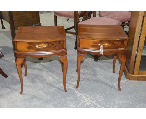 A pair of yew wood lamp tables, 20th Century Each with a bow front top above a single frieze drawer raised upon slender curvi