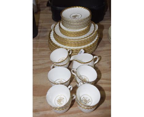 A Minton 'Gold rose' part dinner and tea service Comprising of eight tea cups, eight saucers, milk jug, sugar bowl, nine dinn