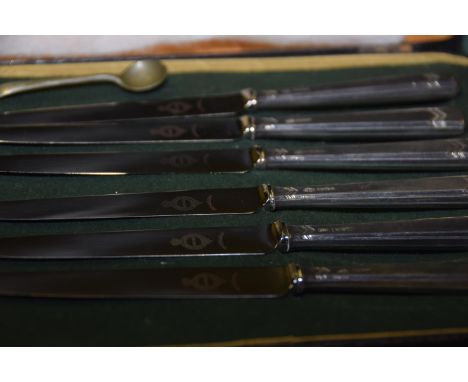 A cased set of silver knivesEach with a geometric patterned handle, Alexander Clark & Co Ltd., Sheffield, 1960. 