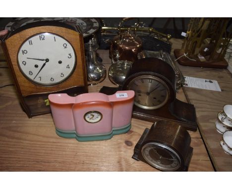 Four assorted wall and mantle clocksTo include a Mid 20th Century German wall clock with a 18cm painted dial, an early 20th C
