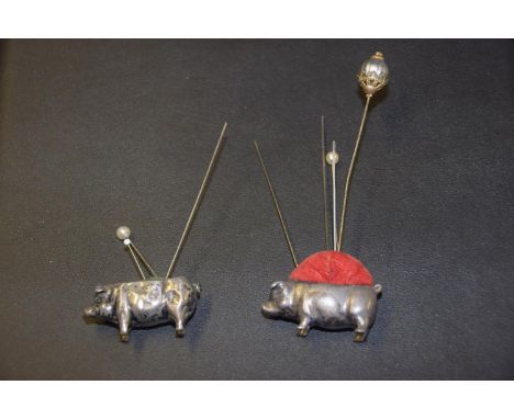Two silver novelty pin cushionsEach designed as a pig, with velvet pin cushion back, hallmarks for Birmingham and London, 191