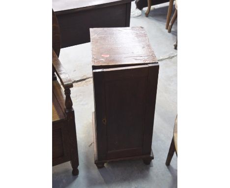 A pair of Victorian stained pine pedestal cupboardsEach with a single panel door enclosing a single drawer above a fixed shel