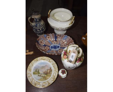 A collection of decorative ceramicsTo include a Cauldon pedestal bowl with gilt handles, a German blue and white lidded stein