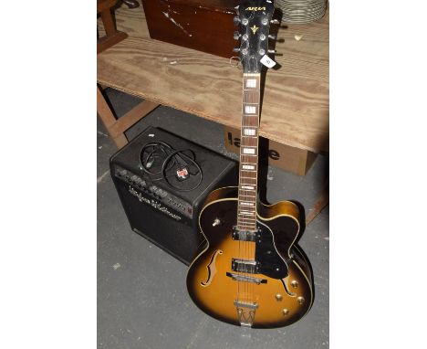 A Gibson copy electric guitar by Aria Fitted with two pick ups on a Sunburst ground along with a Hughes and Vettner Metro Ver