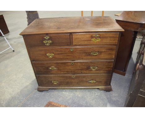 A Georgian mahogany chest of drawersHaving a moulded rectangular top above two short and three long graduated drawers each ap