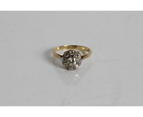 A yellow gold diamond cluster ring, marked 18ct, ring size, K 1/2, approx. weight 2.43gms. Online viewing and bidding only. N