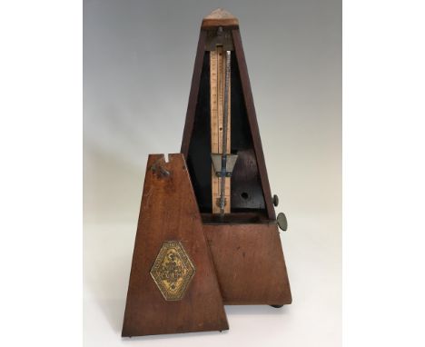 A Maezel Paquet metronome. IMPORTANT: Online viewing and bidding only. No in person collections, an additional charge of £15 