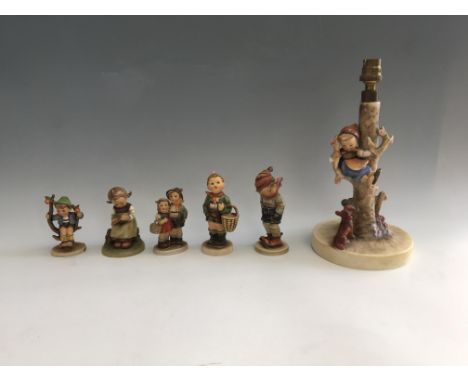 Six Geoebel figurines including lamp with girl on tree branch above dog, boy in hat and scarf, girl writing alphabet etc. IMP