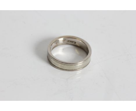 A white gold wedding band ring, marked 750, ring size K 1/2, approx. weight 4.93gms. Online viewing and bidding only. No in p