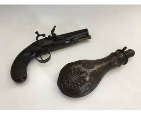 A pistol marked ‘Nunn’, length 21cm, with a powder flask. IMPORTANT:&nbsp;Online viewing and bidding only. Collection by appo