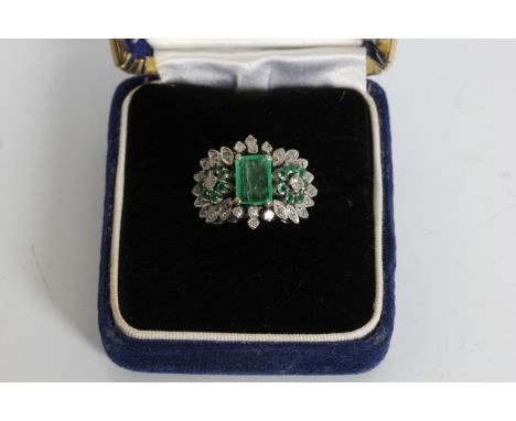 A white metal gem stone and diamond chips cluster ring, ring size K 1/2, approx. weight 7.34gms. Online viewing and bidding o