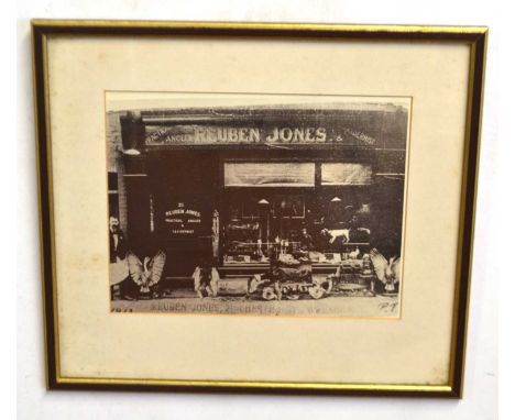 Two taxidermy related framed prints to include framed photographic print of front of Ruben Jones' Taxidermist shop and furthe