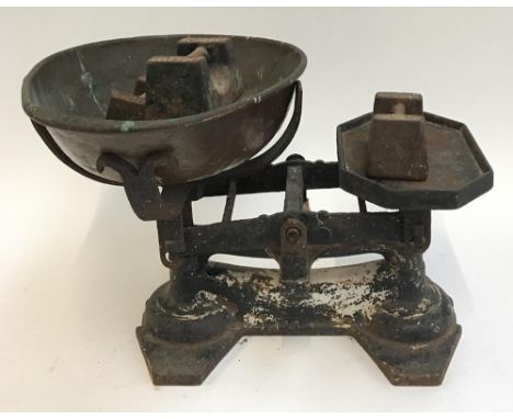 A good set of large kitchen scales with weights and large copper bowl 