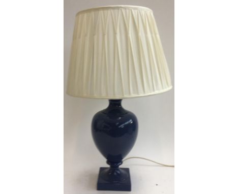 A blue ceramic table lamp, with shade 