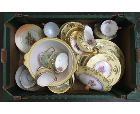 A pale yellow and gilt tea service together with one other 