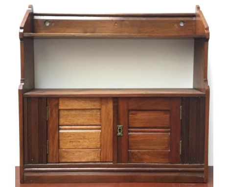 A hanging spice rack, two shelves above two cupboard doors 