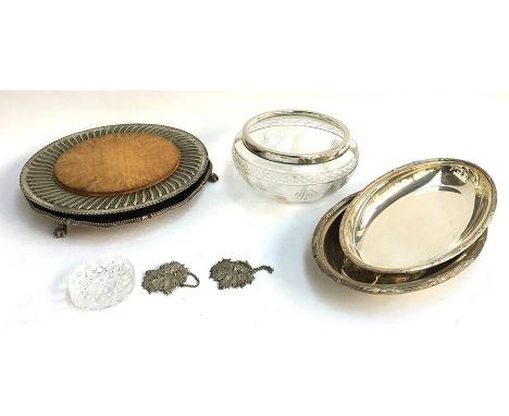 Two plated oval serving dishes, and two plated round trays, one with wood inset, and a large cut glass bowl with plated rim, 