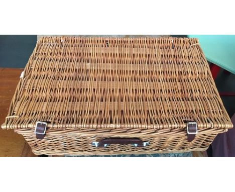 A wicker picnic hamper with contents 