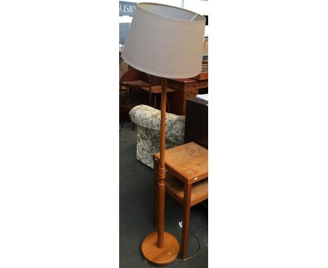 A turned wood standard lamp, with shade 